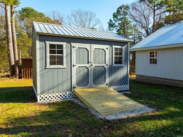 view of outdoor structure with a yard