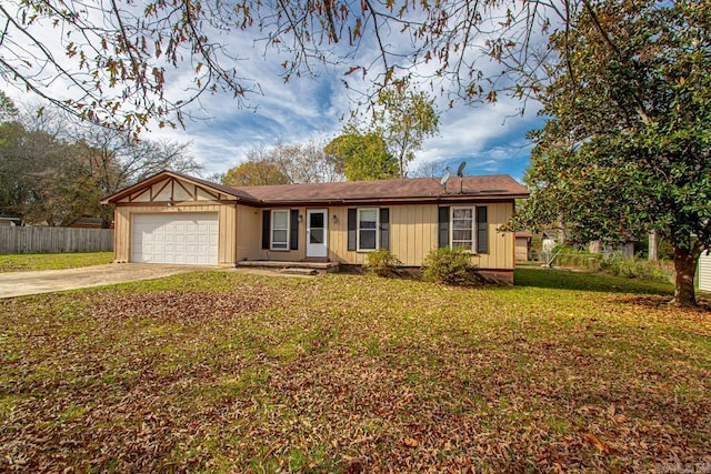 ranch-style house featuring a garage and a front lawn