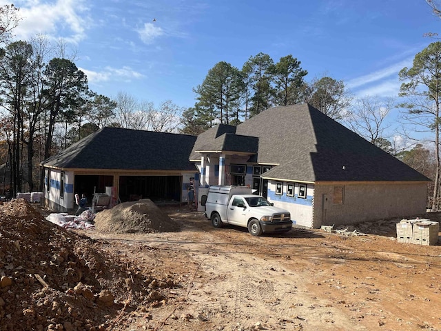 view of front of property with a garage