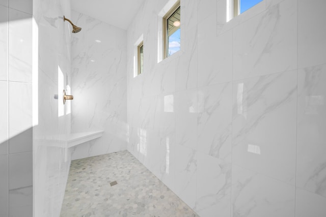 bathroom with tiled shower