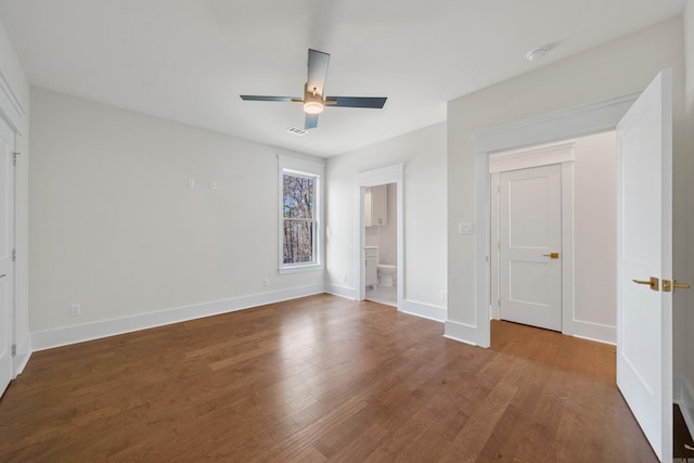 unfurnished bedroom featuring hardwood / wood-style flooring, ceiling fan, and ensuite bathroom