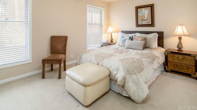 bedroom featuring light colored carpet