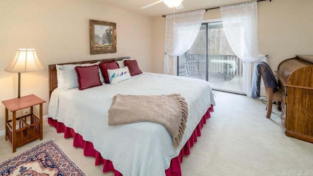 carpeted bedroom featuring access to exterior and ceiling fan