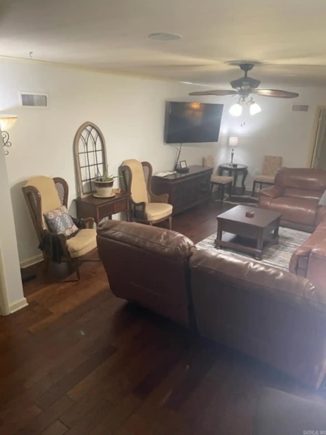 living room with ceiling fan and dark hardwood / wood-style floors