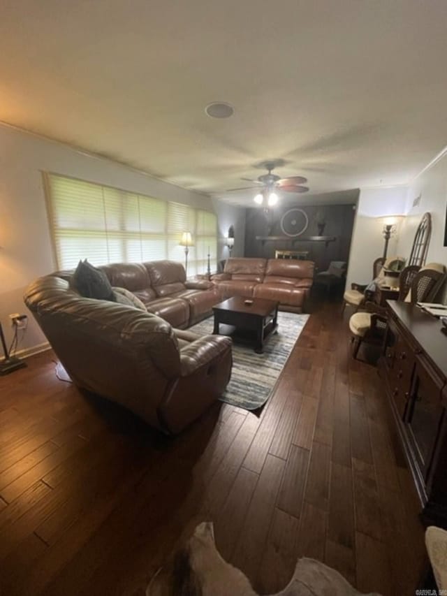 living room featuring dark hardwood / wood-style floors and ceiling fan