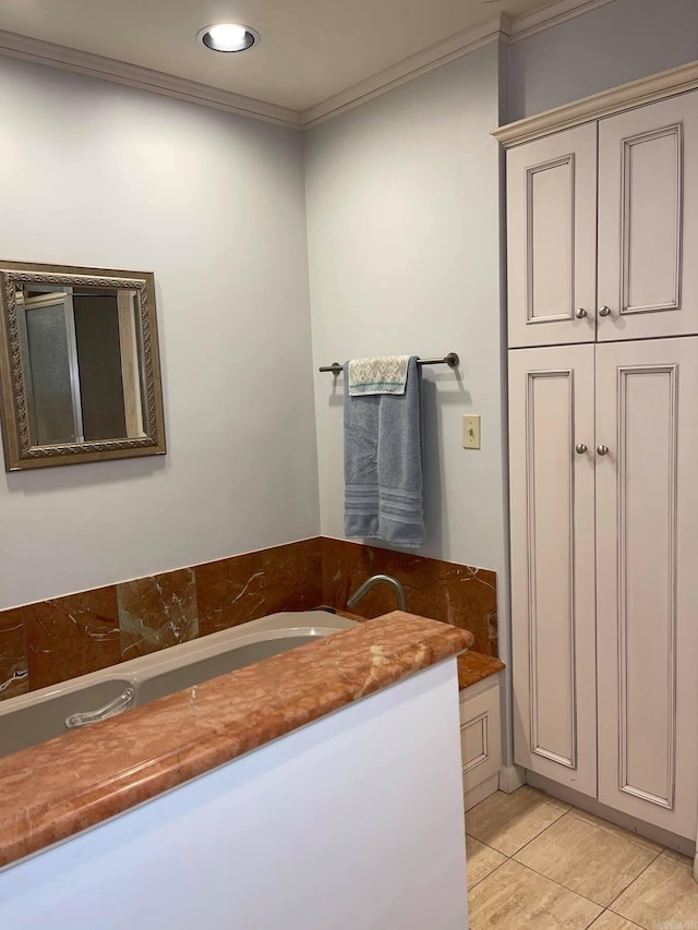 bathroom featuring tile patterned floors, vanity, and ornamental molding