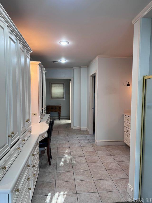 hallway with light tile patterned floors