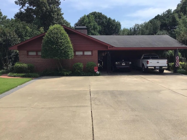 single story home featuring a carport