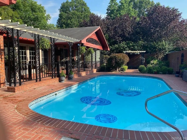 view of pool featuring a patio area and a pergola