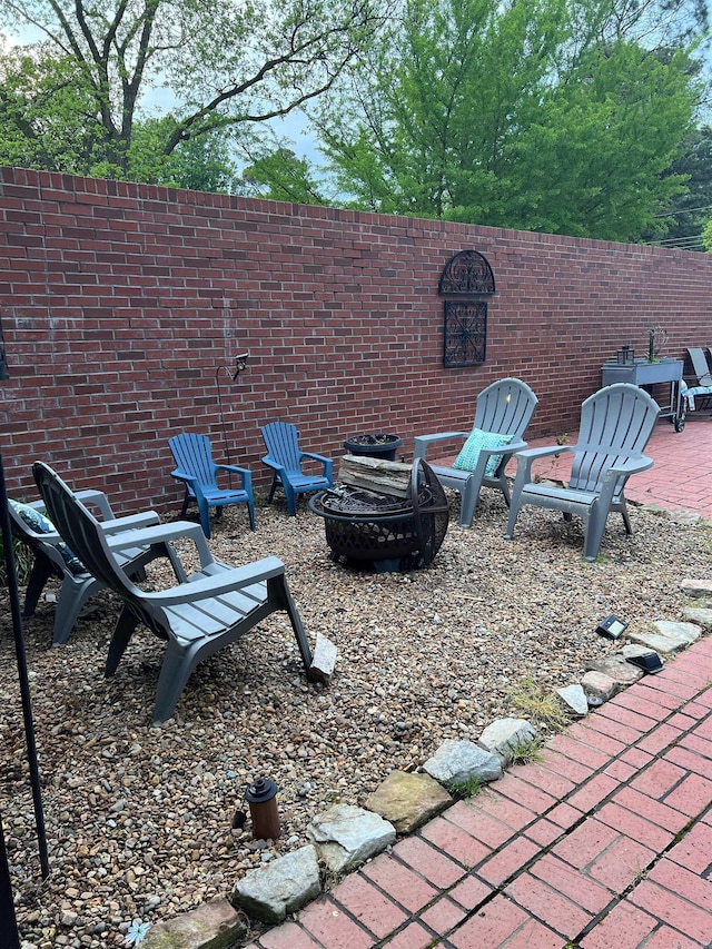 view of yard featuring a fire pit and a patio area