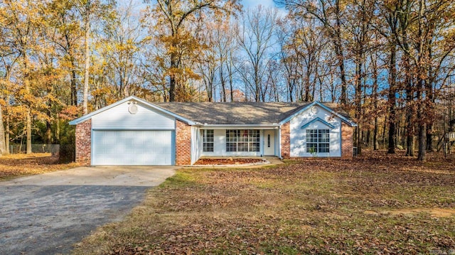 ranch-style home featuring a garage