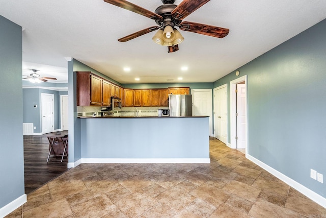 kitchen featuring ceiling fan, backsplash, kitchen peninsula, light hardwood / wood-style floors, and appliances with stainless steel finishes