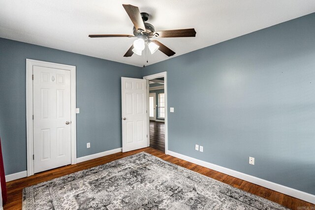 bedroom with ceiling fan and hardwood / wood-style floors