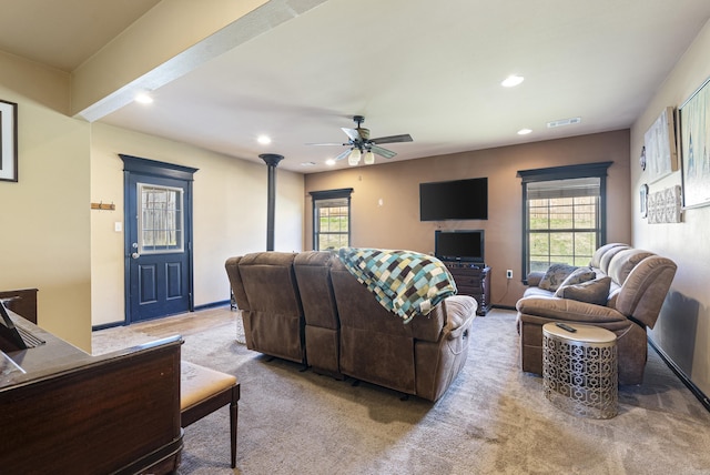 living room with ceiling fan and light colored carpet