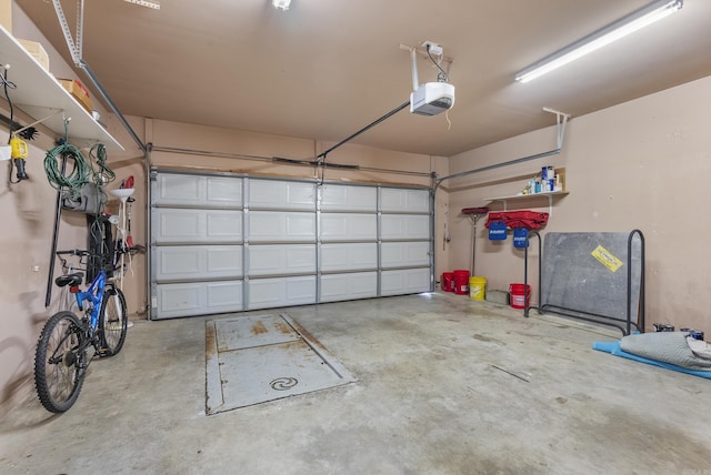 garage featuring a garage door opener