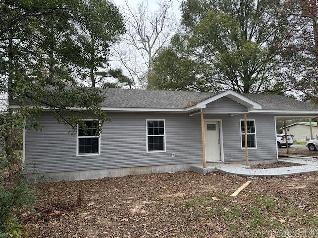 view of front of home with a carport