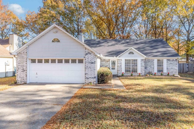 single story home with a front yard and a garage