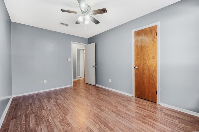 unfurnished room with ceiling fan and light hardwood / wood-style flooring