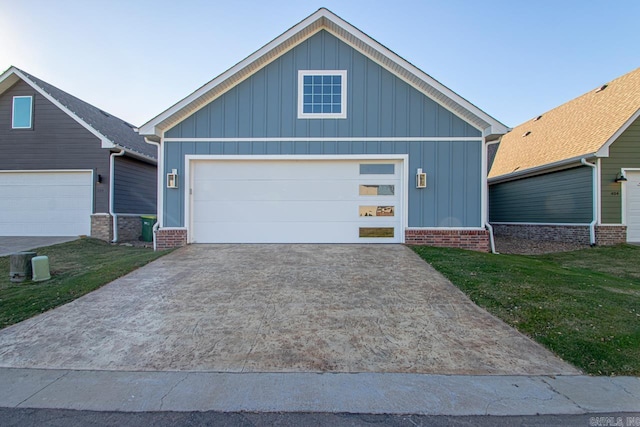 view of front of house with a garage and a front lawn