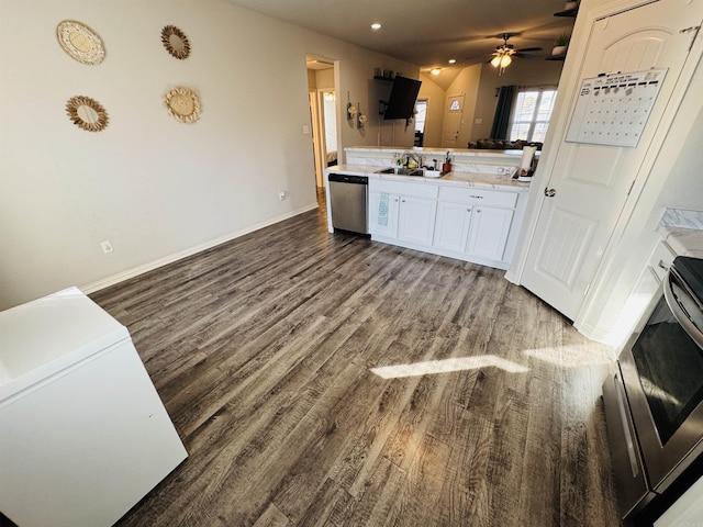 kitchen with appliances with stainless steel finishes, ceiling fan, sink, hardwood / wood-style floors, and white cabinetry