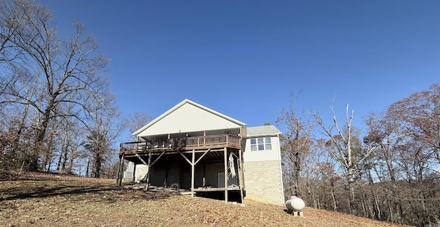 back of property with a deck