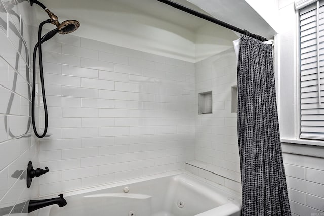 bathroom with shower / bath combo with shower curtain