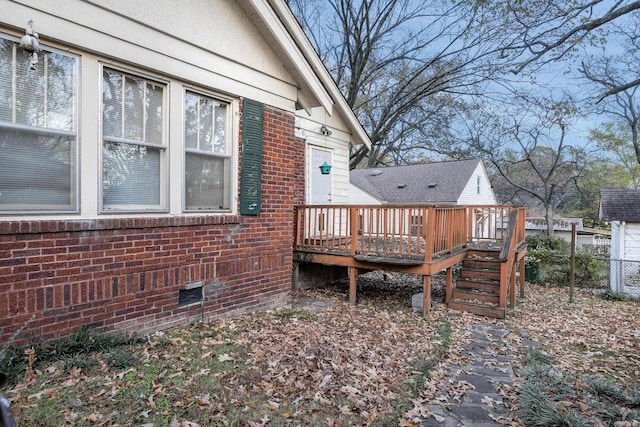 rear view of house featuring a deck