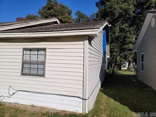 view of property exterior with a yard