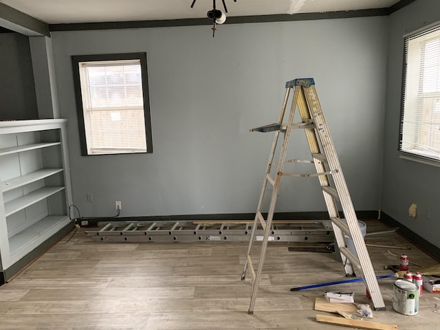 spare room featuring crown molding and hardwood / wood-style flooring