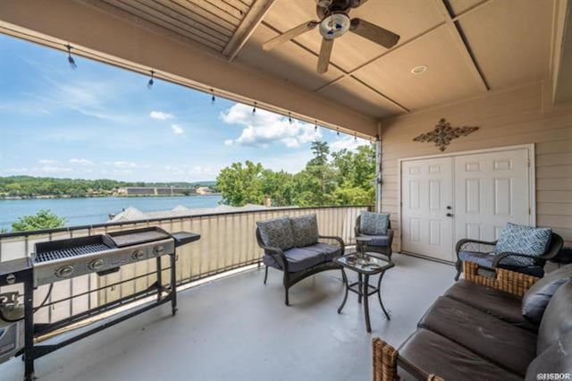 balcony featuring ceiling fan, a water view, an outdoor hangout area, and grilling area