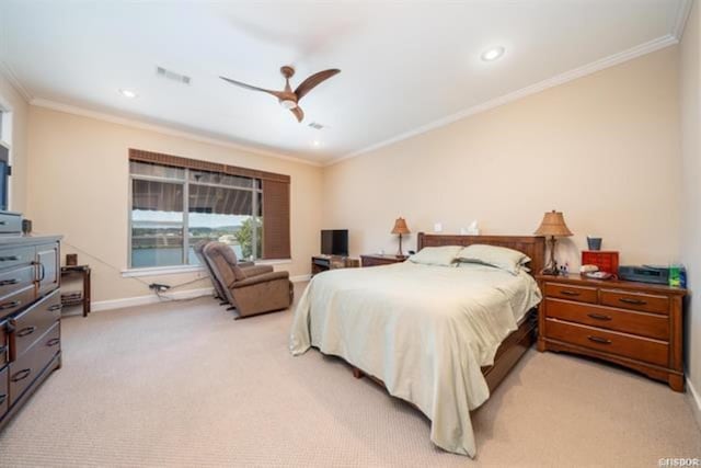 carpeted bedroom featuring ceiling fan and ornamental molding