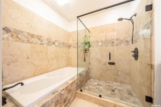 bathroom with shower with separate bathtub