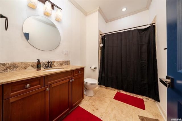 bathroom featuring vanity, toilet, and ornamental molding