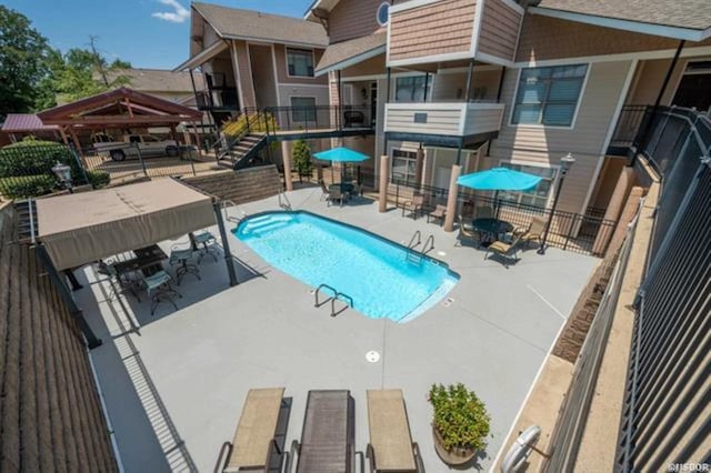 view of swimming pool featuring a patio area