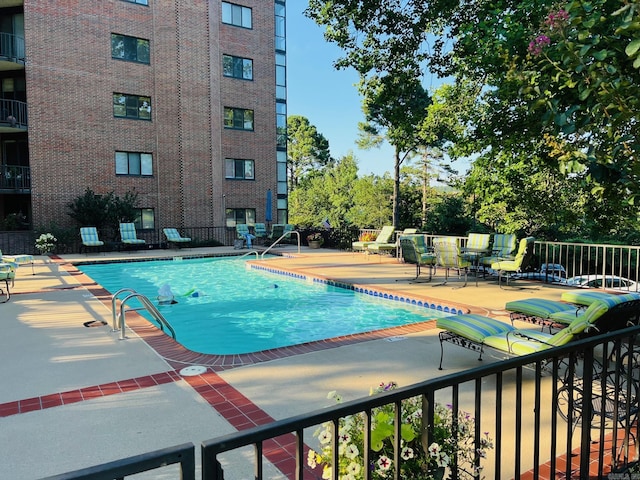 view of swimming pool with a patio area