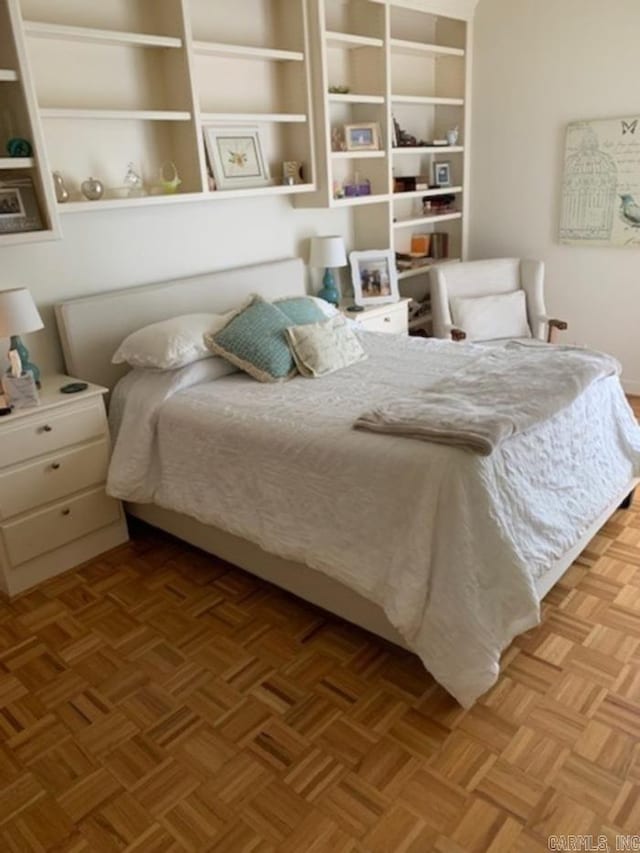 bedroom featuring light parquet flooring