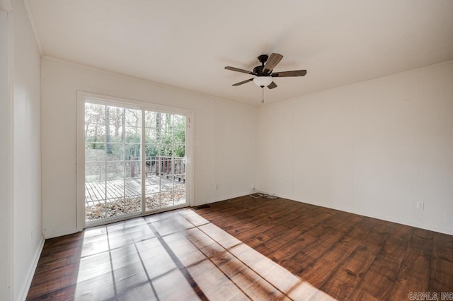 empty room featuring ceiling fan, wood-type flooring, and ornamental molding