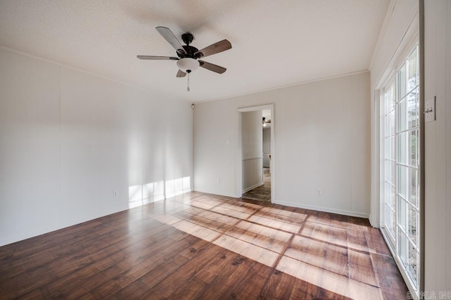 spare room featuring hardwood / wood-style flooring, ceiling fan, and ornamental molding