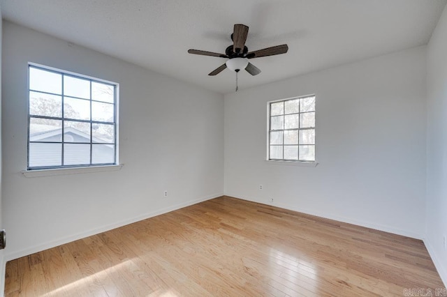 unfurnished room featuring light wood-type flooring and ceiling fan