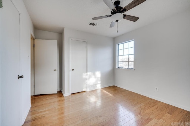 unfurnished bedroom featuring light hardwood / wood-style flooring and ceiling fan