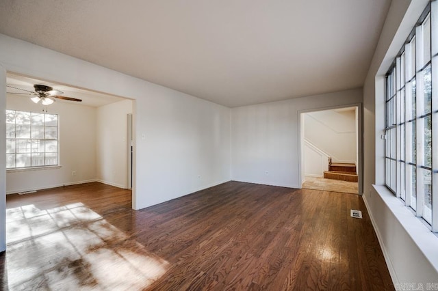 spare room with hardwood / wood-style floors and ceiling fan