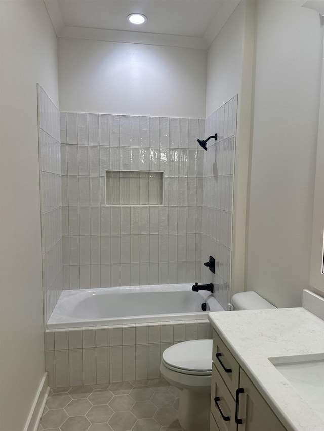 full bathroom featuring crown molding, tile patterned flooring, vanity, and tiled shower / bath combo