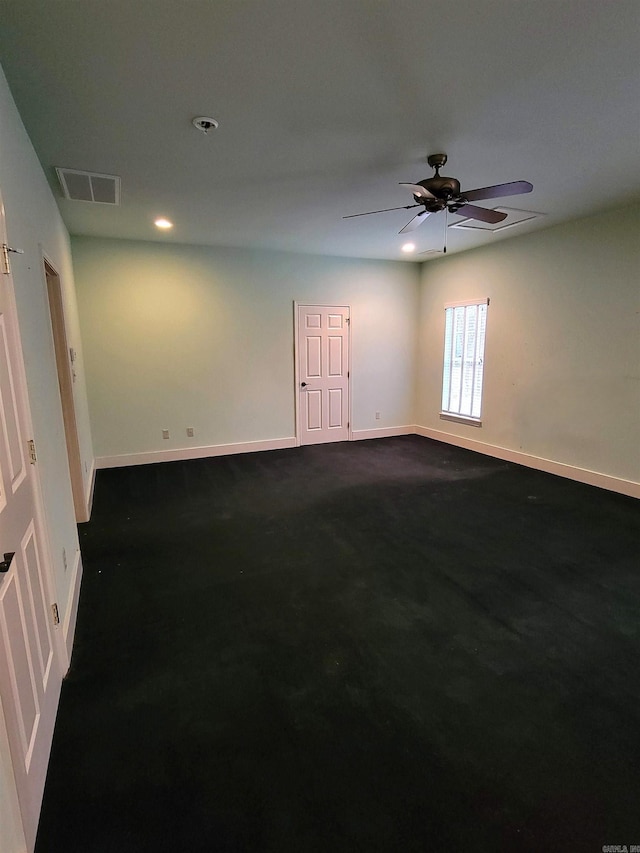 carpeted empty room featuring ceiling fan