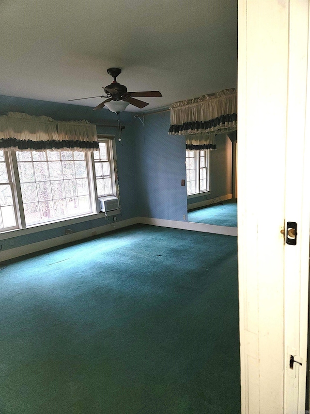 unfurnished room with ceiling fan, carpet, and cooling unit