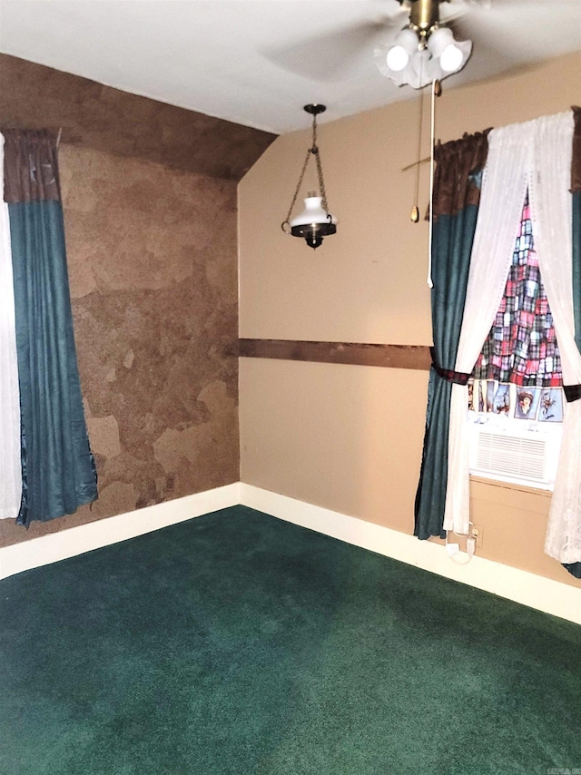 empty room with ceiling fan and carpet flooring