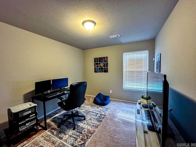 office area featuring carpet and a textured ceiling