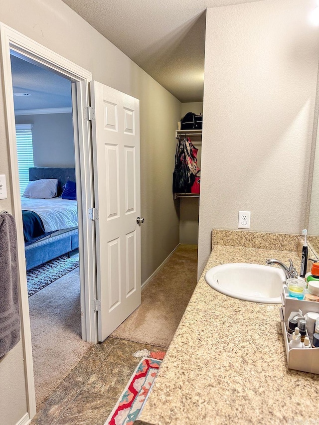 bathroom featuring vanity and a textured ceiling