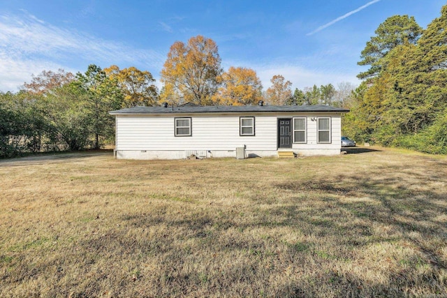 rear view of house with a lawn