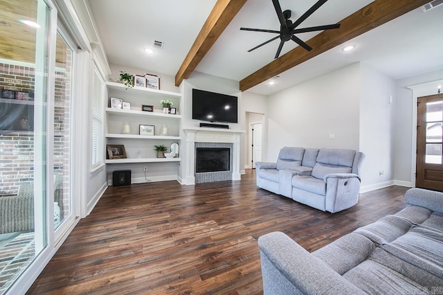 living room featuring beam ceiling, dark hardwood / wood-style floors, and ceiling fan