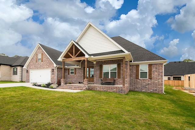 craftsman inspired home with covered porch, a garage, and a front yard